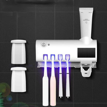 Automatic toothpaste dispenser with toothbrush holder